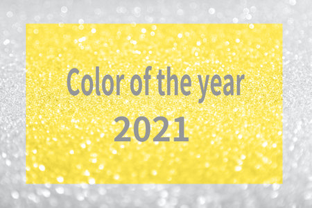 Beautiful festive shine glitter bright glowing gray, ultimate, yellow, illuminating background blur, radiance, text "Color year 2021" concept fashion, beauty season 2021 design spring, summer.の写真素材