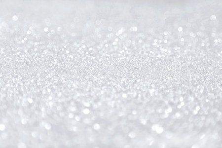 Beautiful festive shine glitter bright ultimate glowing gray background blur, radiance. Perfect background color 2021. The trend of the spring and summer season the fashion design industry. Place text.の写真素材