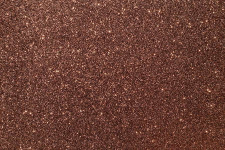 Brown gold glitter texture sparkling festive glowing shiny wrapping paper background for Christmas and New Year party, copy-space holiday wallpaper decoration, greeting and wedding invitation card.の写真素材