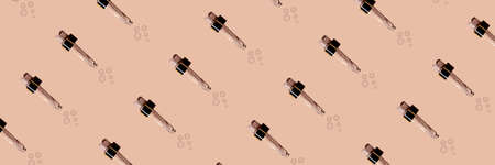 Seamless pattern banner transparent glass pipette with a cosmetic, anti-aging serum natural ingredients on a pastel pink paper background in the sun with a beautiful shadow. Top view, diagonal.の写真素材