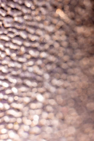 Gold creative bokeh on backgroundの写真素材