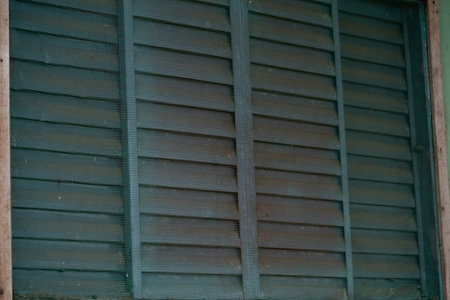 Blue metal window with anti insect grilleの写真素材