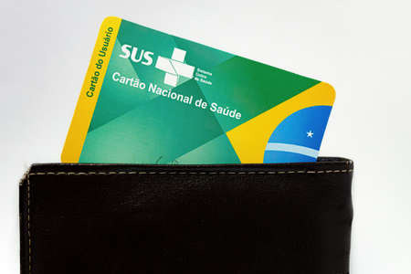 Cassilandia, Mato Grosso do Sul, Brazil - 11 20 2021: User Card national health card of the Brazilian government program SUS (Sistema Unico de Saude) in the walletのeditorial素材