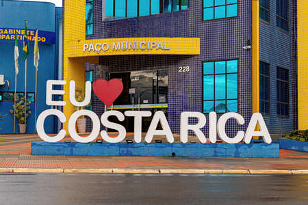 city hall building of brazilian tourist city costa rica with sign saying love the cityのeditorial素材