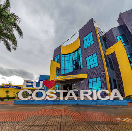 city hall building of brazilian tourist city costa rica with sign saying love the cityのeditorial素材