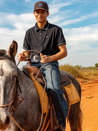 Apore, Goias, Brazil - 05 07 2023: Horseback riding event open to the public on public roads in the Brazilian city of Aporeのeditorial素材