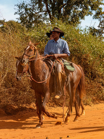 Apore, Goias, Brazil - 05 07 2023: Horseback riding event open to the public on public roads in the Brazilian city of Aporeのeditorial素材