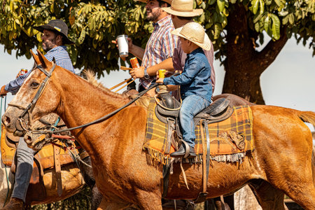 Apore, Goias, Brazil - 05 07 2023: Horseback riding event open to the public on public roads in the Brazilian city of Aporeのeditorial素材