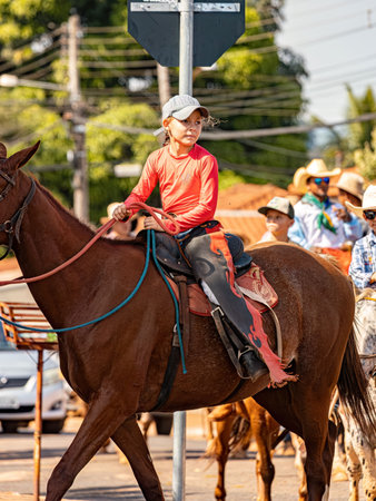 Apore, Goias, Brazil - 05 07 2023: Horseback riding event open to the public on public roads in the Brazilian city of Aporeのeditorial素材