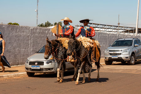 Apore, Goias, Brazil - 05 07 2023: Horseback riding event open to the public on public roads in the Brazilian city of Aporeのeditorial素材