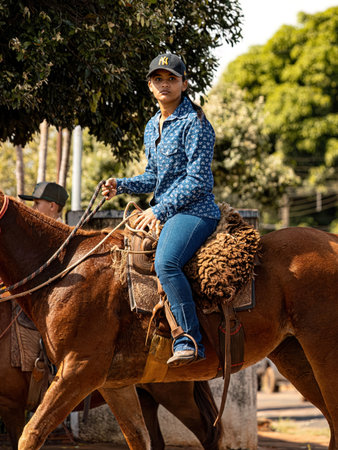 Apore, Goias, Brazil - 05 07 2023: Horseback riding event open to the public on public roads in the...