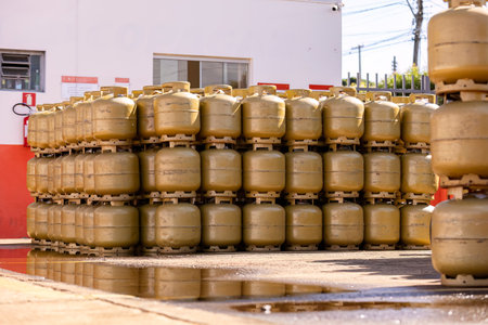 pile of kitchen gas cylinders outside a storeの写真素材