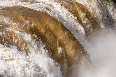 close up of water falling in a river waterfall