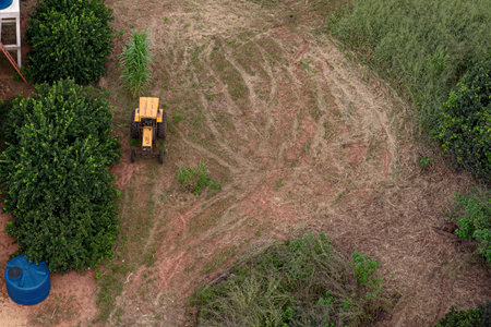 aerial image of rural farm space with old tractorの写真素材