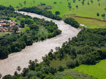 Cassilandia, Mato Grosso do Sul, Brazil - 04 16 2024: Aerial image of the apore river next to the city cassilandiaのeditorial素材