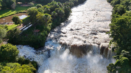 Cassilandia, Mato Grosso do Sul, Brazil - 04 18 2024: aerial image of the Salto Do Rio Apore tourist spot in cassilandia waterfallのeditorial素材