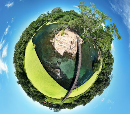 Lagoa Santa, Goias, Brazil - 07 05 2024. Tiny planet spherical panorama created from drone photographs showing the geothermal lagoon of Thermas de Lagoa Santa with wooden walkway and floating aquatic vegetation.のeditorial素材