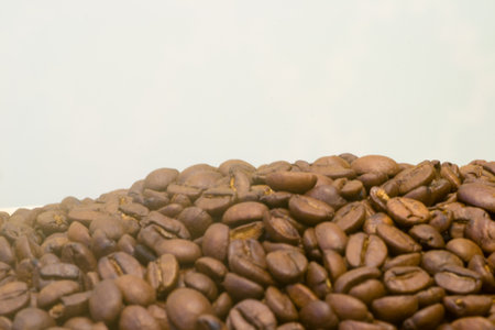 A cup of coffe with coffee bean as backgroundの写真素材