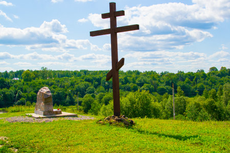 wooden cross in the village in summer