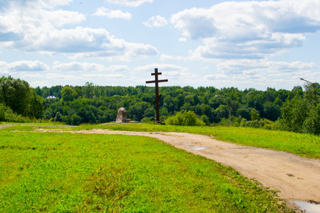 wooden cross in the village in summerの写真素材
