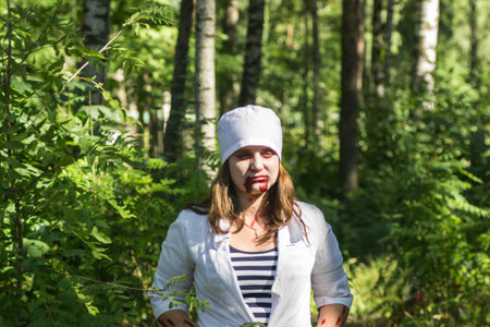 Saint Petersburg, Russia - August 15, 2015: people dressed as zombies parade on the street while walking in St. Petersburg zombie, the zombie walk is part of the event a flash mob.のeditorial素材