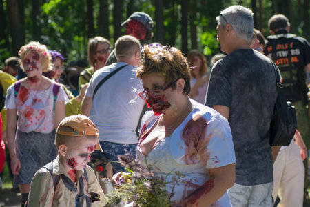 Saint Petersburg, Russia - August 15, 2015: people dressed as zombies parade on the street while walking in St. Petersburg zombie, the zombie walk is part of the event a flash mob.のeditorial素材