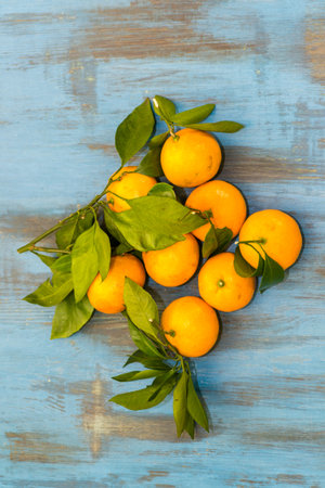 tangerines on wooden background juicy few piecesの写真素材