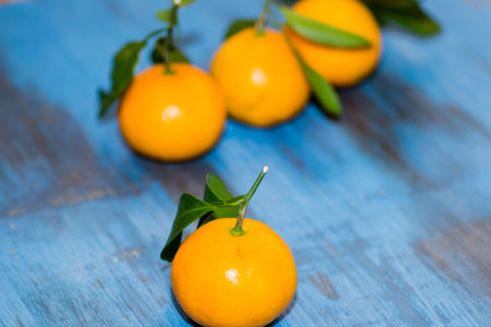tangerines on wooden background juicy few piecesの写真素材