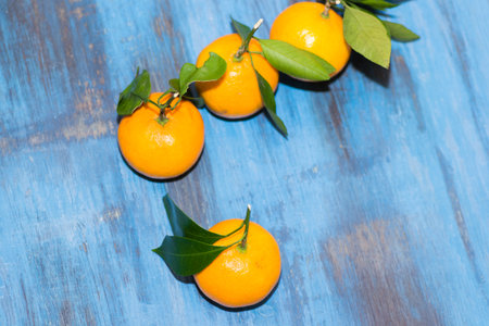 tangerines on wooden background juicy few piecesの写真素材