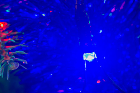 Christmas tree green closeup with a garlandの写真素材