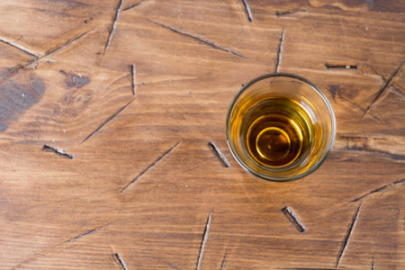 a stack of alcohol on wooden countertop with the keysの写真素材