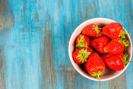 strawberries on wooden background fresh and ripeの写真素材