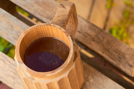 beer in a wooden mug on a background of ripe juicy summerの写真素材