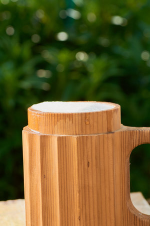 beer in a wooden mug on a background of ripe juicy summerの写真素材