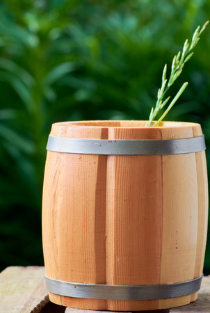 beer in a wooden mug on a background of ripe juicy summerの写真素材