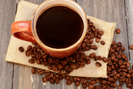 coffee mug on a wooden background of boards close-upの写真素材