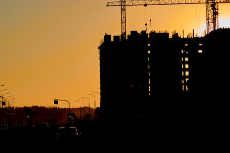 construction of the building cranes in the strongest light, otherwise from the sunの写真素材