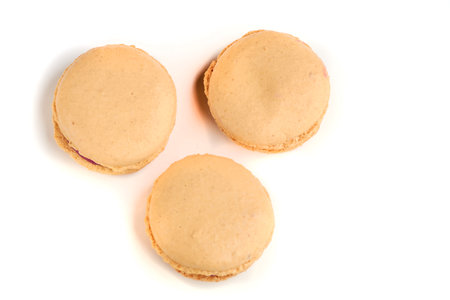 cooking homemade macarons at home with your hands on a white backgroundの写真素材