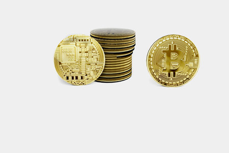 bitcoin coin on white background with reflective surface 3D renderingの写真素材