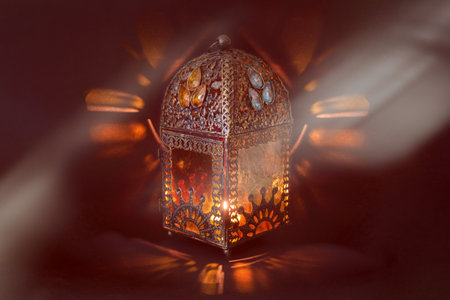 Traditional Arabic lantern lit up for celebrating the Holy Month of Ramadanの写真素材