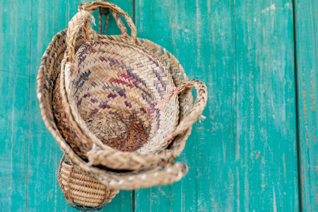 Weaved baskets from dried palm leaves, traditional Emirati handicraft. Handmade UAE arts and crafts.