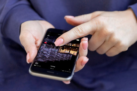 Abu Dhabi, UAE - October 19, 2021: Woman checking daily instagram reels, social media is part of our...