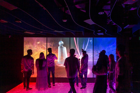 Dubai, UAE - November 28, 2021: People playing with digital wall at Mobility Pavilion at Expo 2020のeditorial素材