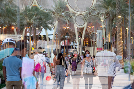 Dubai, UAE - April 4, 2022: People walking at Expo2020 towards and from Al Wasl Plaza, in camera double exposureのeditorial素材