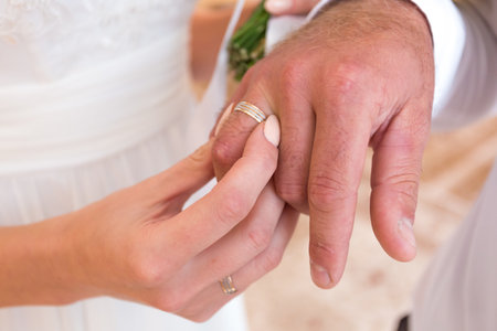 Wedding ceremony, bride, groom, Officiant, outdoors, exchanging ringsの写真素材