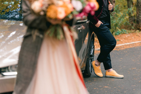 Bride and groom at outdoor wedding ceremony decorations in the autumn.の写真素材