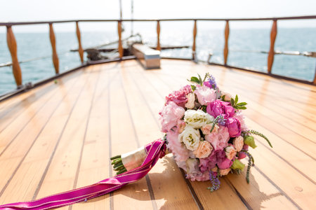 Wedding. Bridal bouquet on a background winch on a yacht. the brides bouquetの写真素材