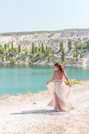 Happy just married young wedding couple celebrating and have fun at beautiful beach sunset in Crimea, Sevastopol.の写真素材