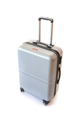 One suitcase isolated on white background. Polycarbonate suitcase isolated on white. Grey suitcase.の写真素材