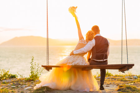 Bride and Groom at Sunset Romantic Married Couple.の写真素材